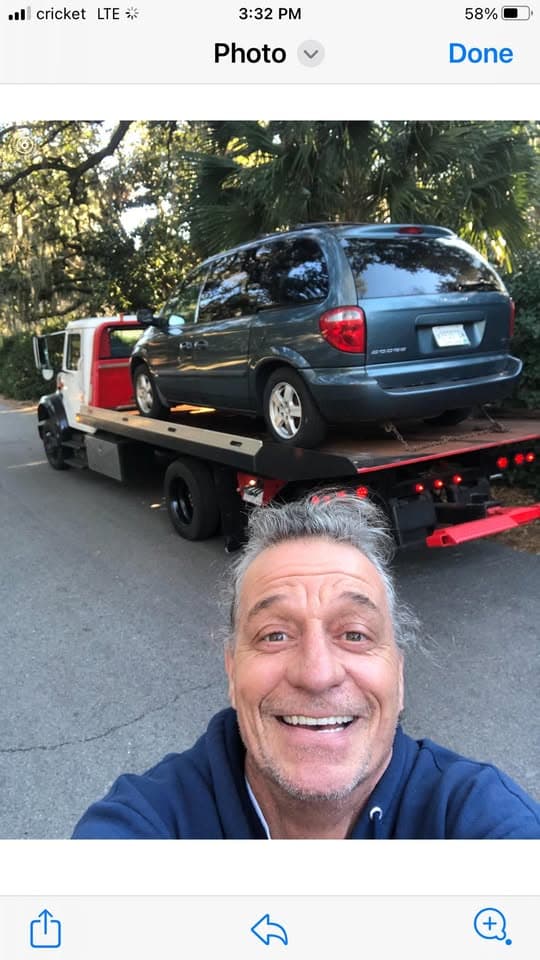 Red Porsche 911 loaded on flatbed