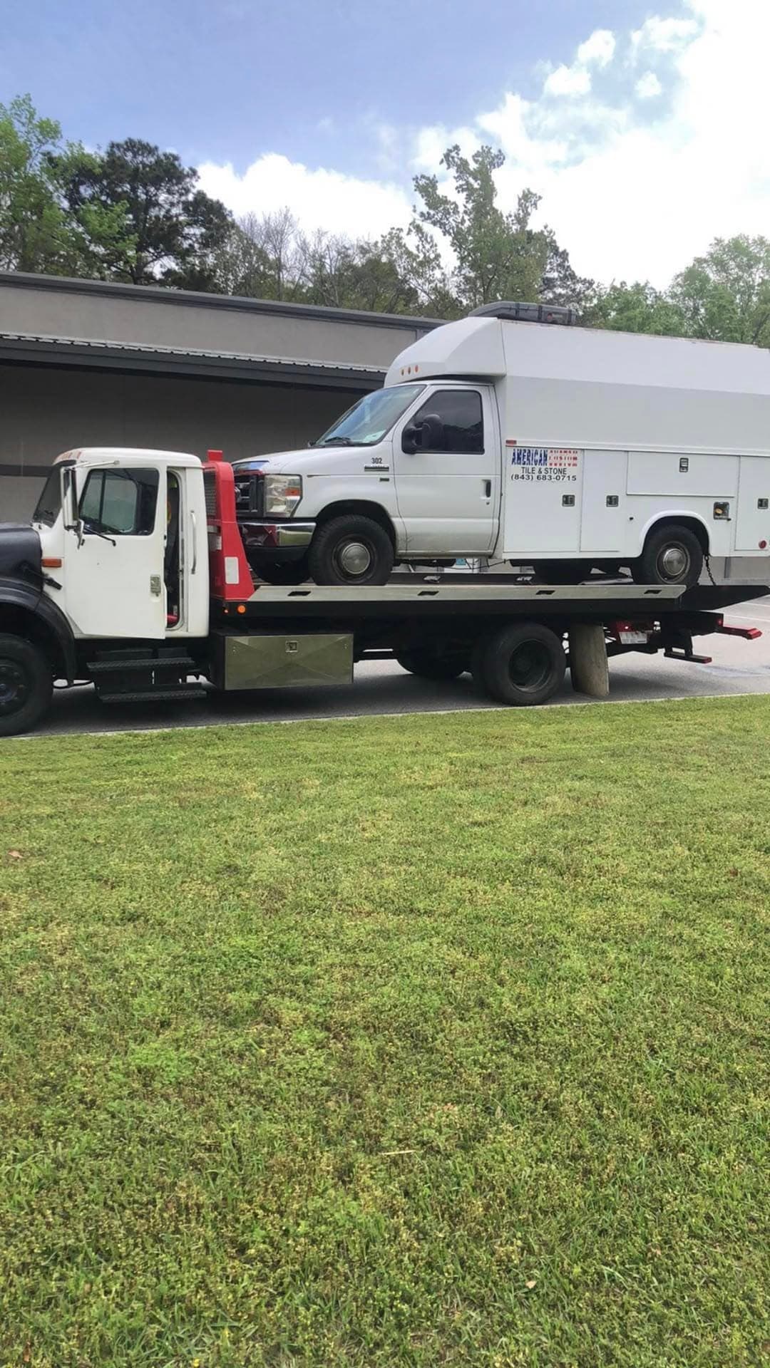 Red Ford F-150 pickup on flatbed